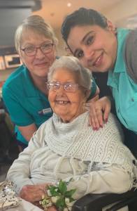 Ellie Mann celebrates with staff at Benetas' Gisborne Oaks. Image supplied.