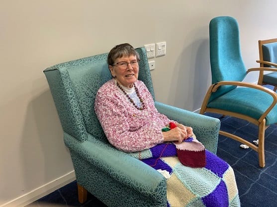 Margery Smith from Blakeney Lodge relaxing in a sunny room at The Haven. Supplied.