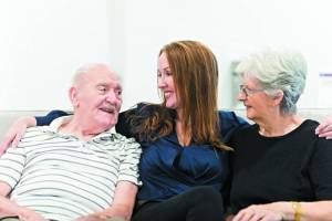 Danielle Burke with her parents, Ted and Kay Atkinson. Image supplied.