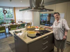 Resident cooks in the communal kitchen. 