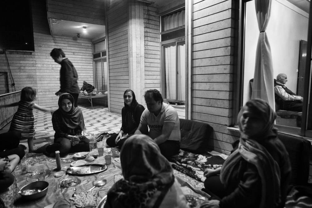 Family gather but Shamsazaran's father prefers to remain inside alone. Source: Jalal Shamsazaran/ NVP Images.