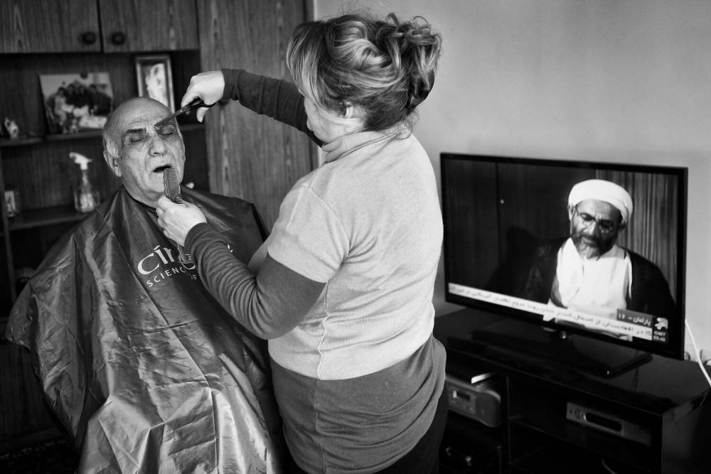 Shamsazaran's sister provides a hair cut. Source: Jalal Shamsazaran/ NVP Images.