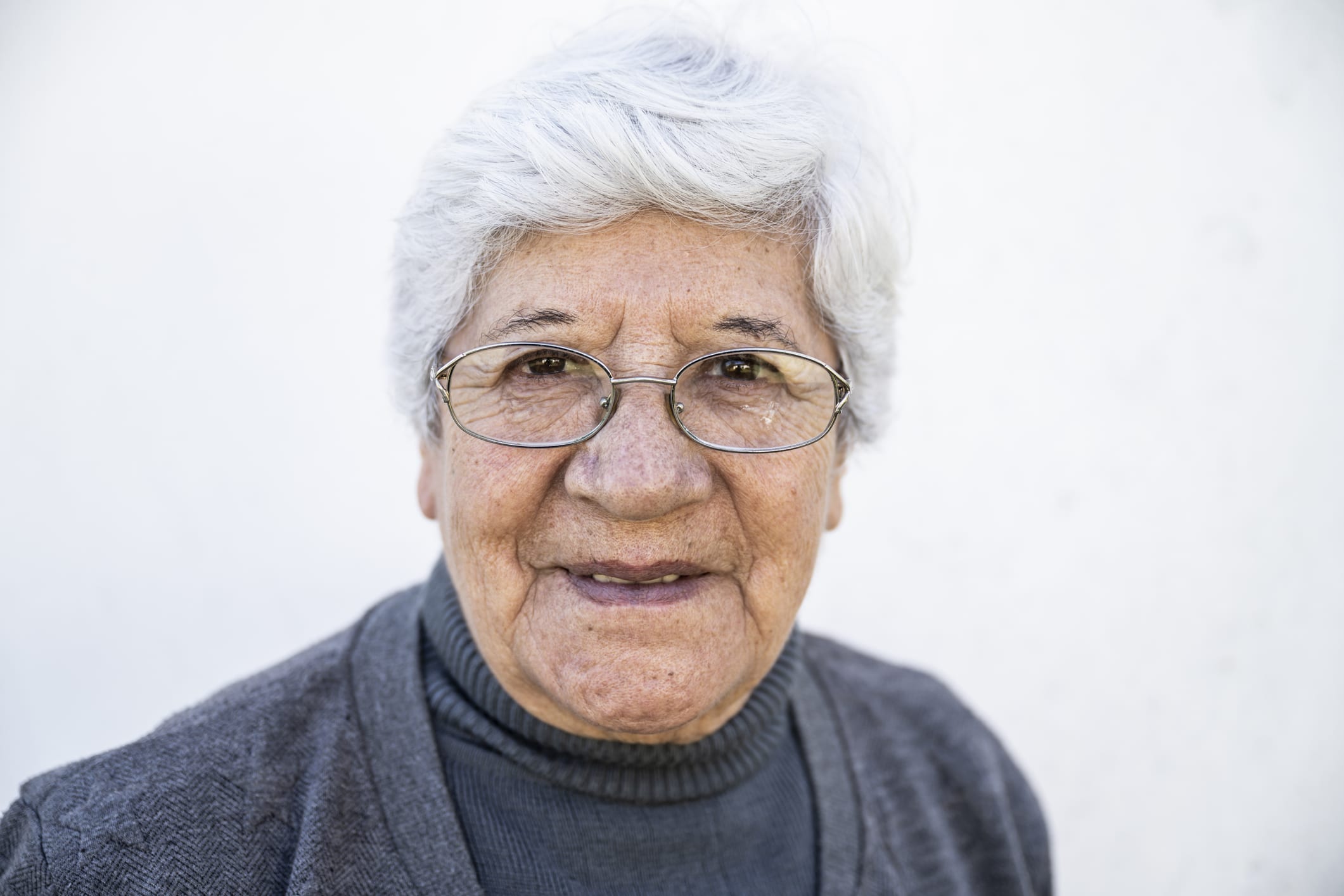Portrait of contented Hispanic senior woman