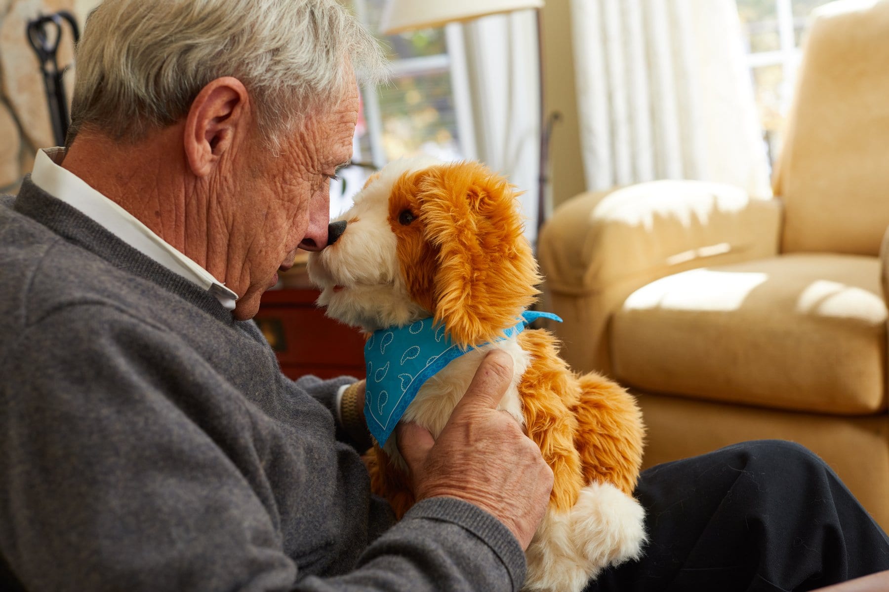 Older man with cute robo pet