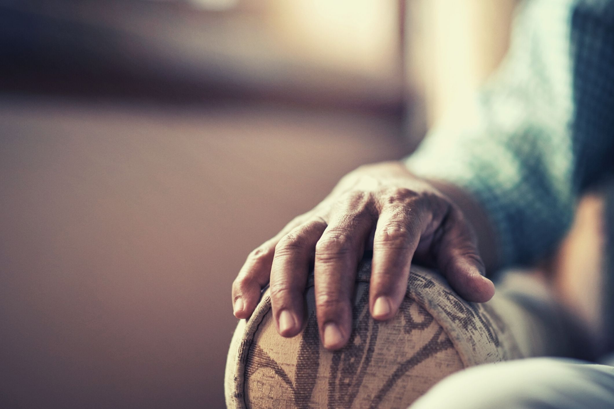 Elderly person's hand aged care home