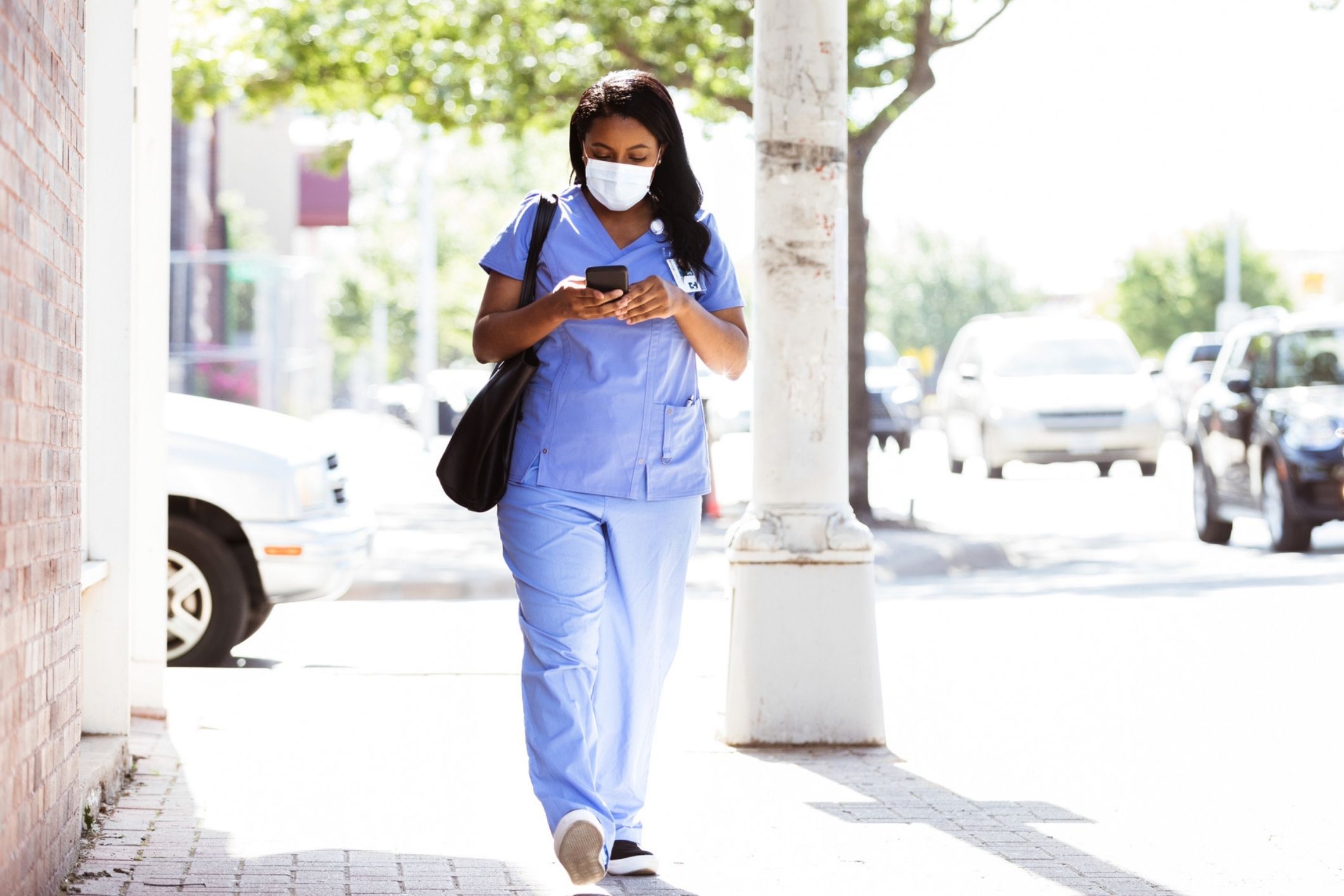 Nurse walking in city