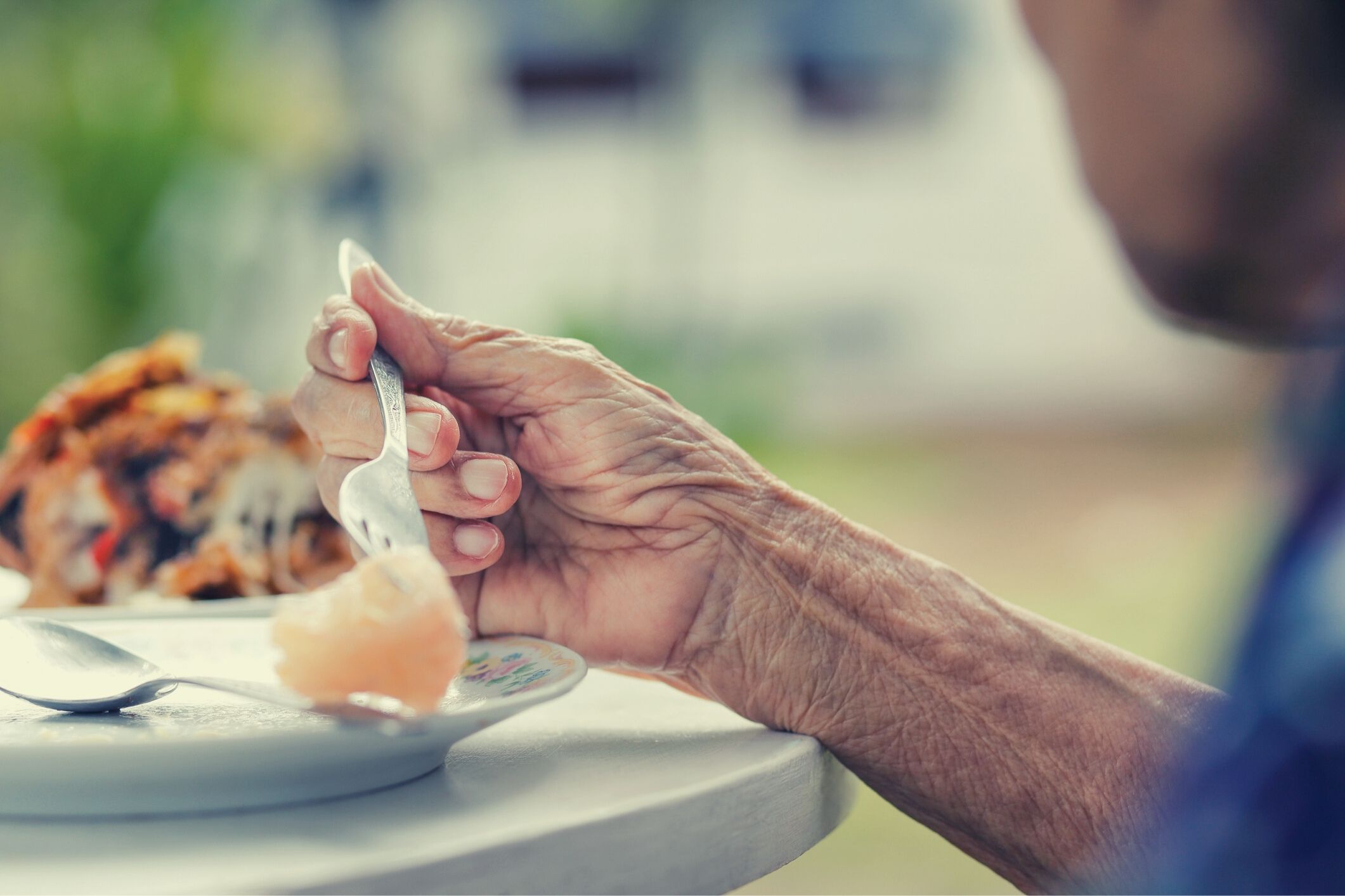 Aged care resident eating meal