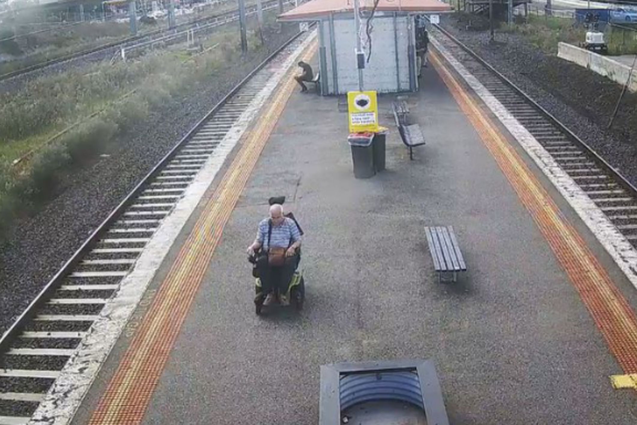 Search for brave strangers who leapt onto train tracks to rescue a man in wheelchair
