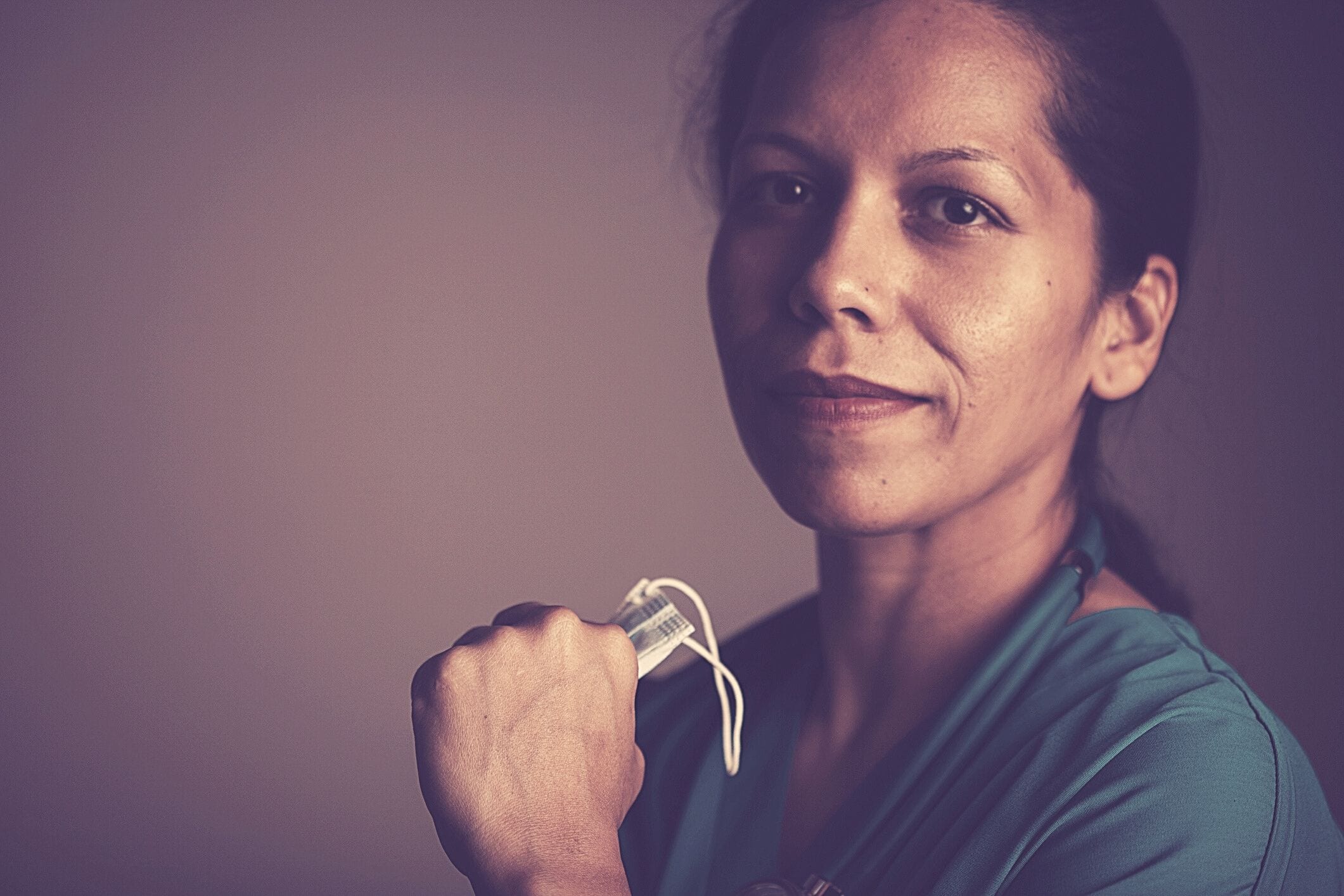 Nurse holding mask