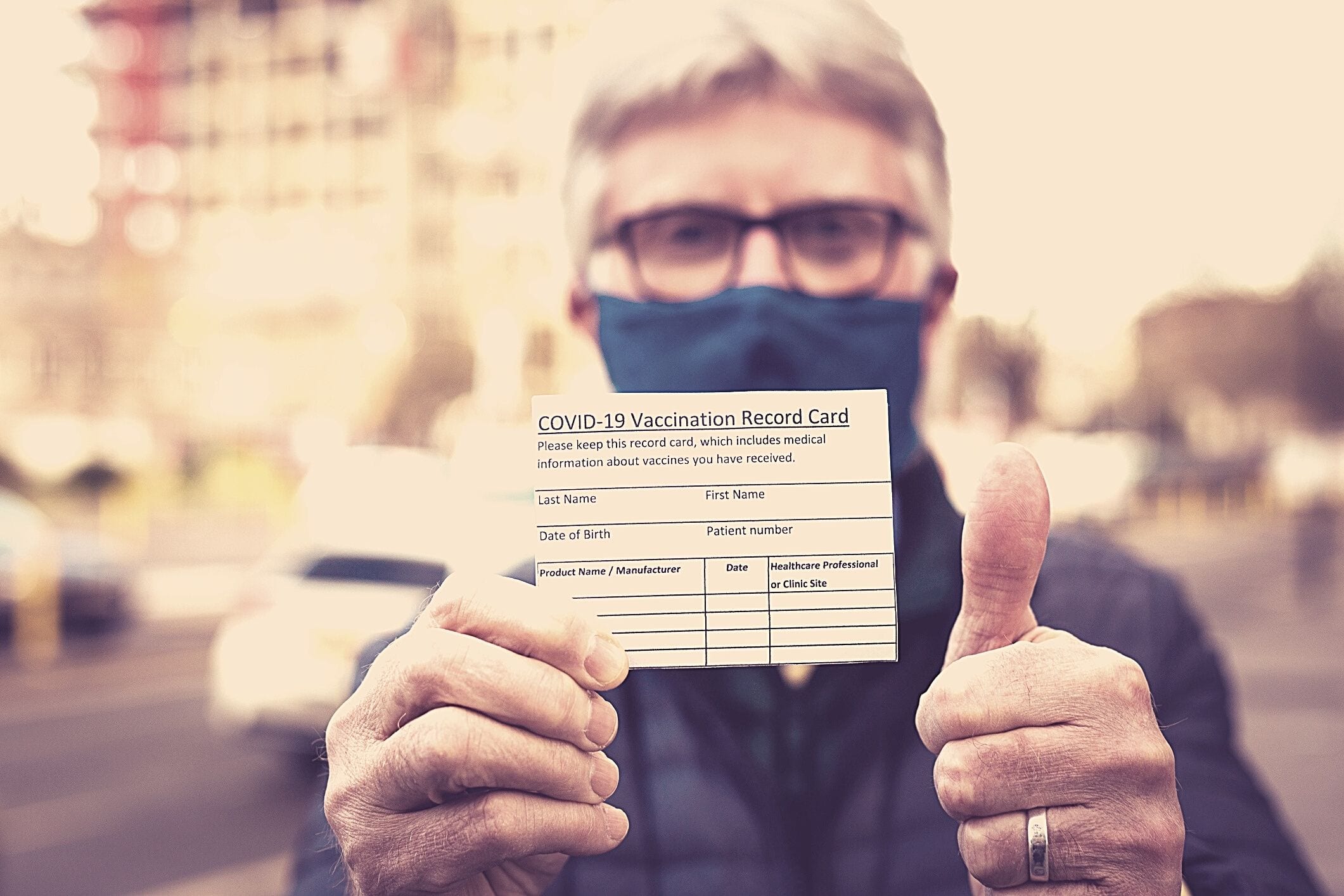 Senior man covid vaccine card