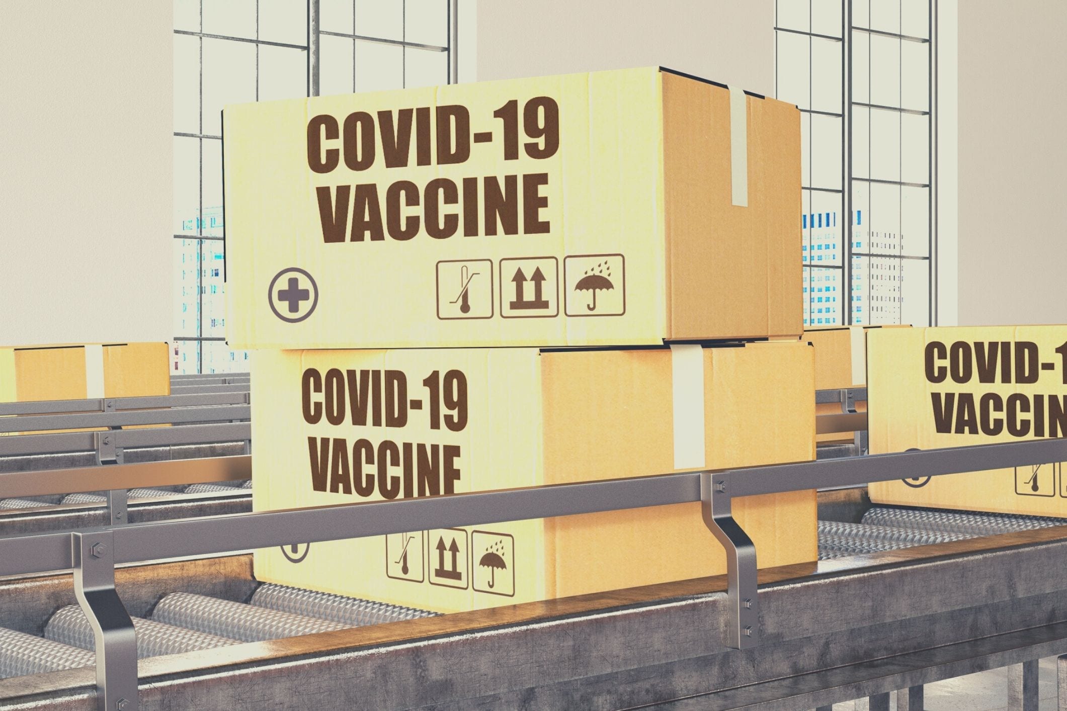 COVID-19 vaccine boxes on conveyor belt