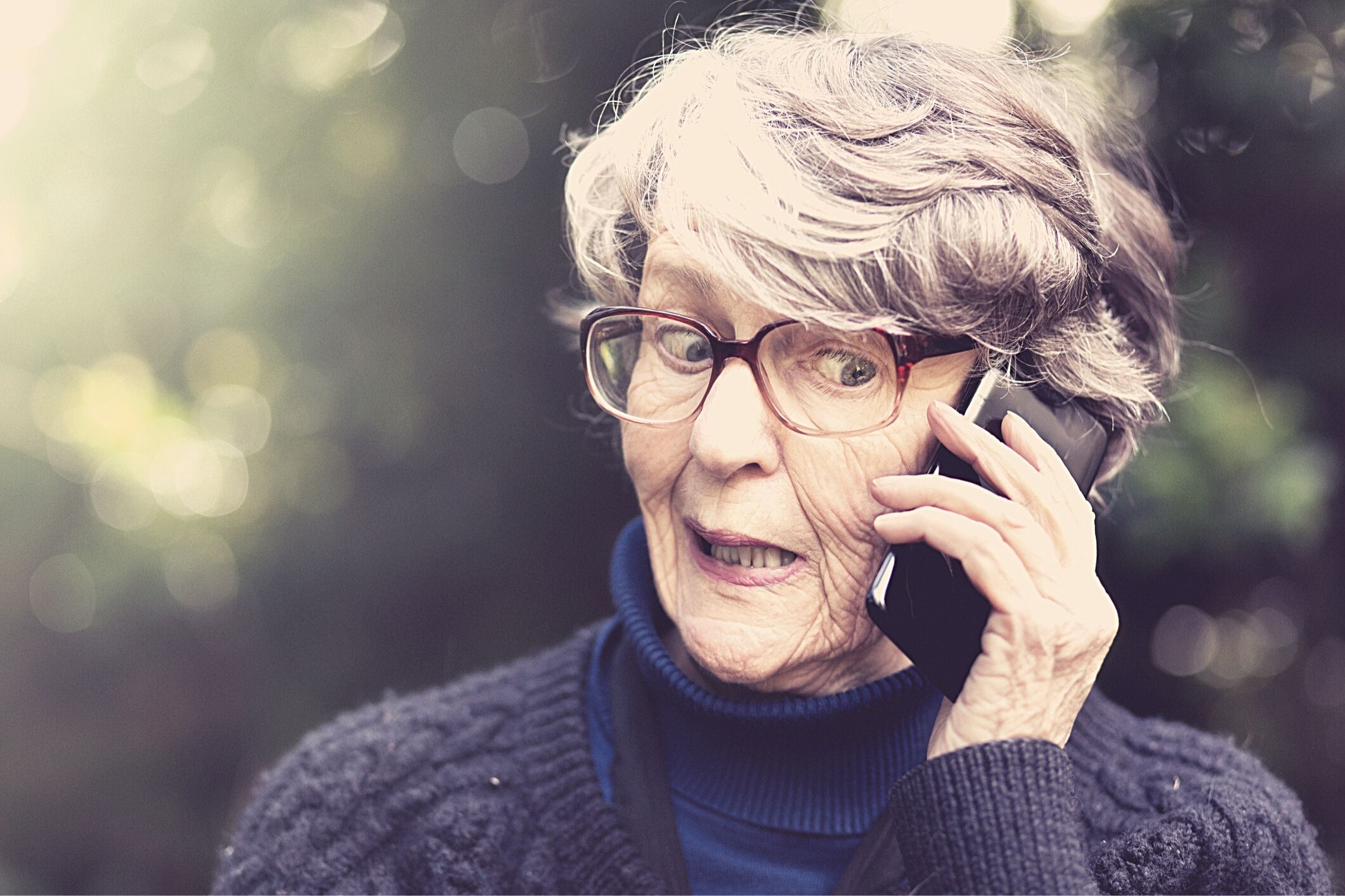 Senior lady confused on mobile phone