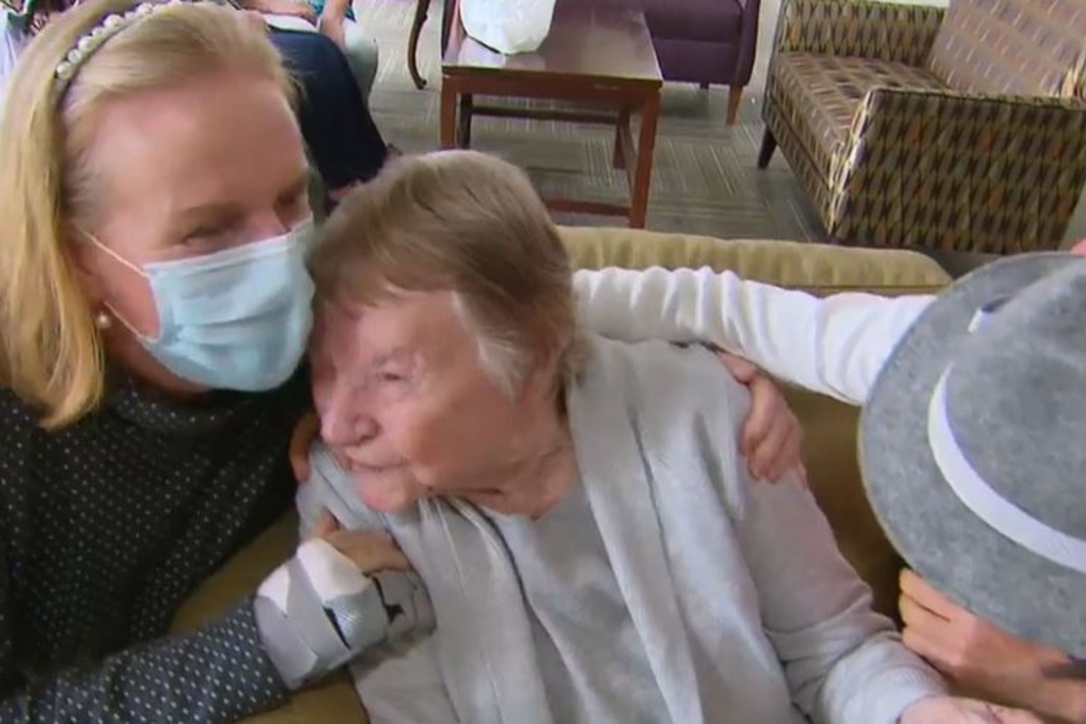 resident Margaret enjoys hugs and kisses from family