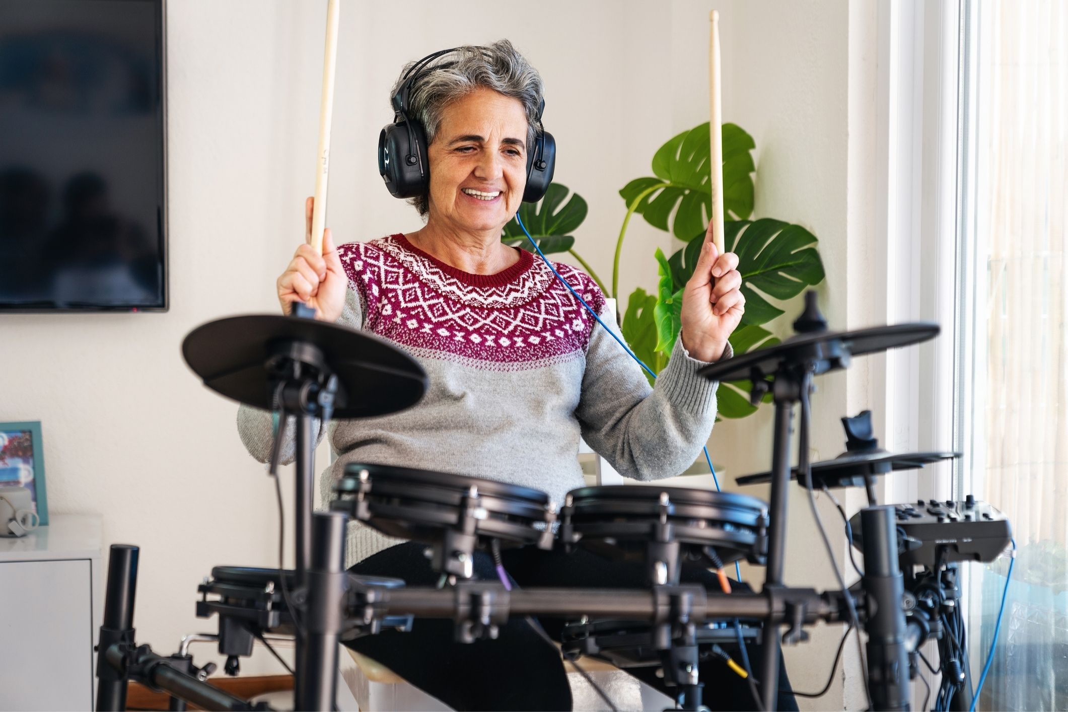 Older woman playing drums