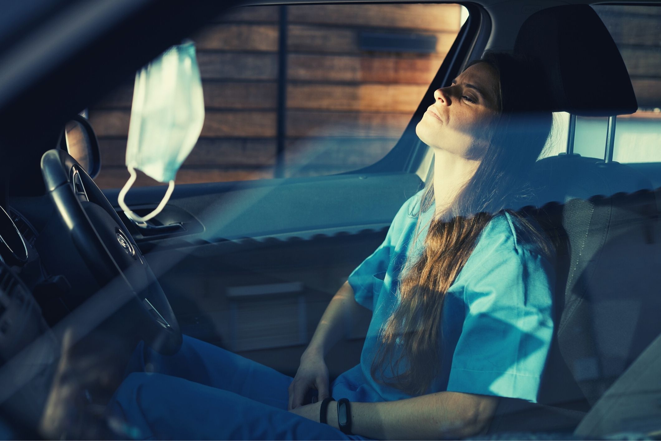 Care worker resting in her car