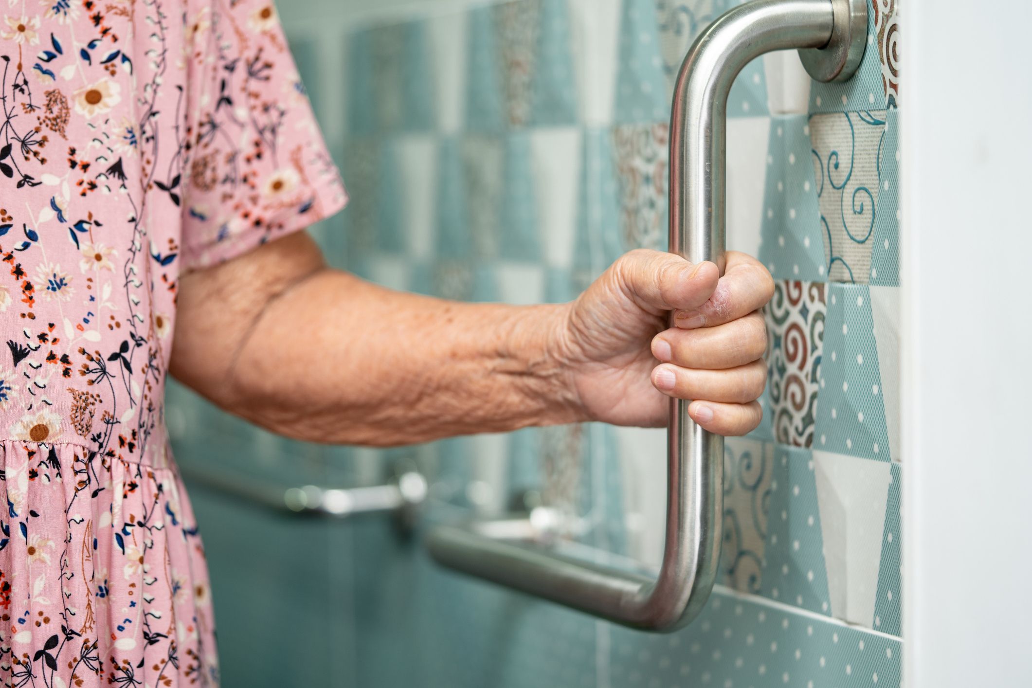 Government set to reverse charges on showers for older Australians after fierce backlash